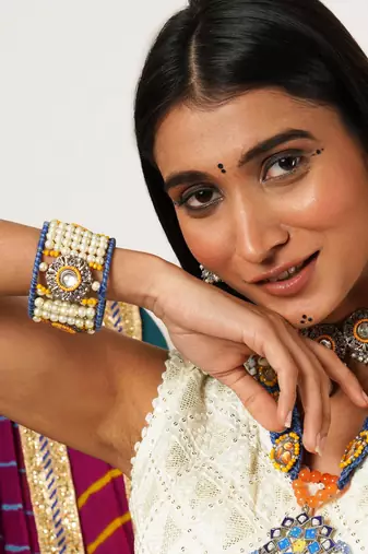 Boho-inspired complete kundan jewelry set with bangle,necklace, waistbelt, and earrings