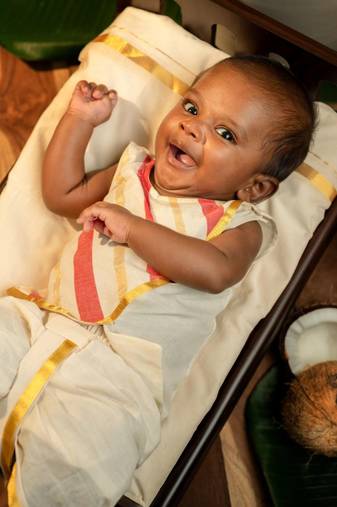 White sleeveless infant handloom kurta, dhoti pant and shoes set for kids