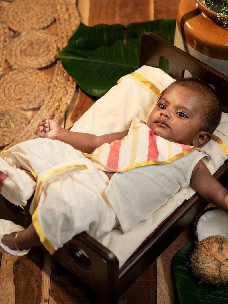 White sleeveless infant handloom kurta, dhoti pant and shoes set for kids