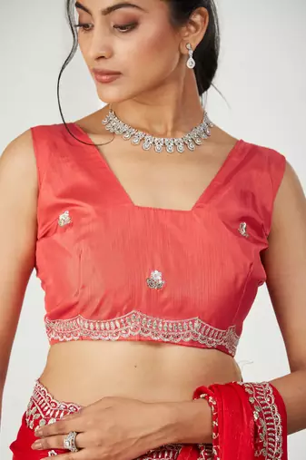 Red embroidered silk blend saree