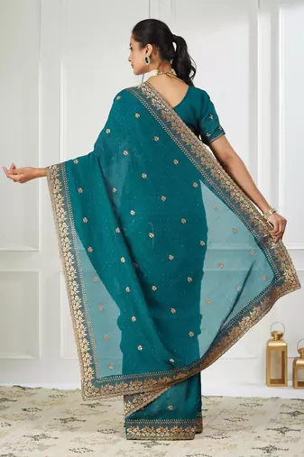 teal embroidered silk blend saree