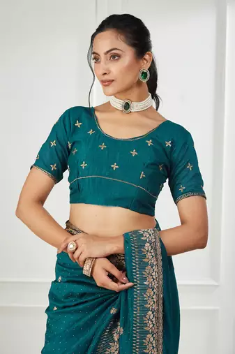 teal embroidered silk blend saree