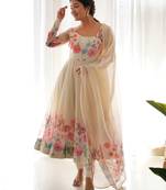 Featuring cream color ethnic wear gown set