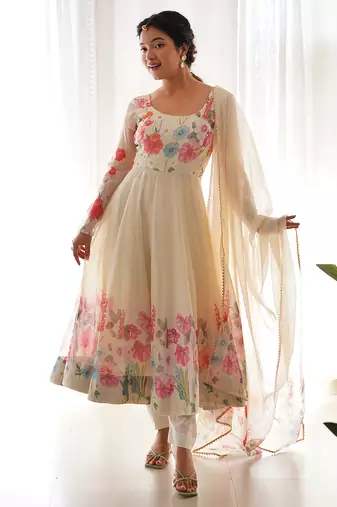 Featuring cream color ethnic wear gown set