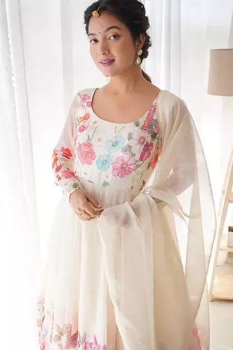 Featuring cream color ethnic wear gown set