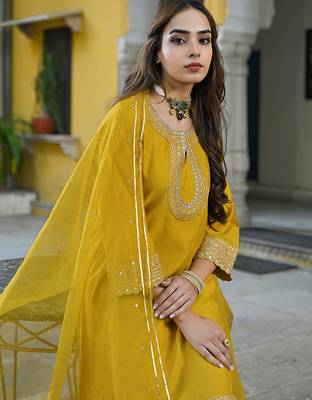 Women mustard silk blend solid embroidered a-line kurta trousers with dupatta 2