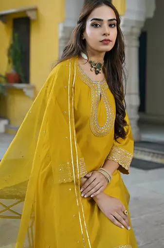 Women mustard silk blend solid embroidered a-line kurta trousers with dupatta