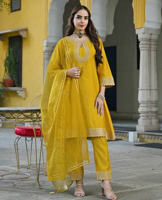 Women mustard silk blend solid embroidered a-line kurta trousers with dupatta 3