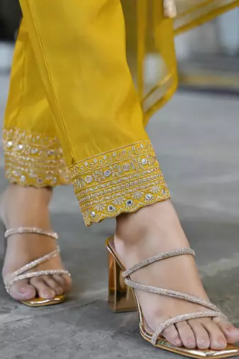 Women mustard silk blend solid embroidered a-line kurta trousers with dupatta