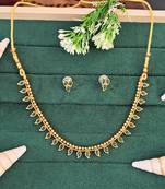 Traditional gold-plated necklace set with green stone leaf design, with delicate earrings