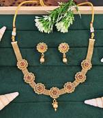 Traditional gold-plated floral necklace set with ruby stones, mesh chain design, drop earrings