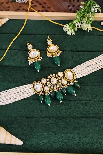 Traditional kundan choker necklace and earring set with green emerald drops, pearl beaded string, gold-plated