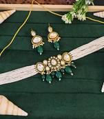 Traditional kundan choker necklace and earring set with green emerald drops, pearl beaded string, gold-plated