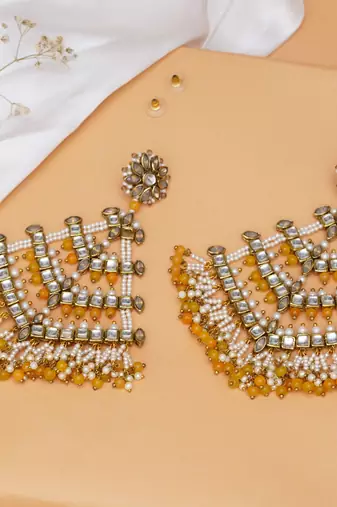 Traditional kundan dangler earrings with yellow beads & white pearls