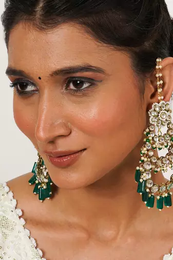 Traditional kundan chandelier earrings with green stones