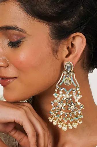 Pastel kundan earrings with floral design and pearl fringe