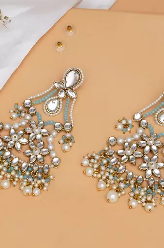 Pastel kundan earrings with floral design and pearl fringe