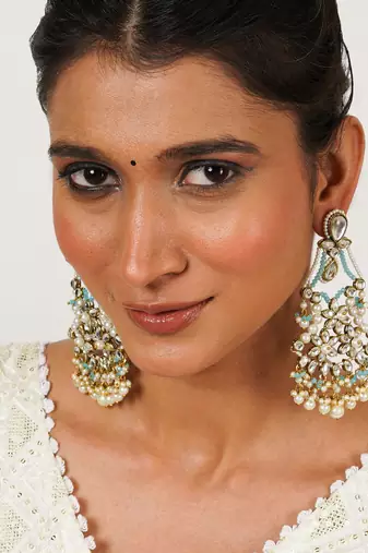 Pastel kundan earrings with floral design and pearl fringe