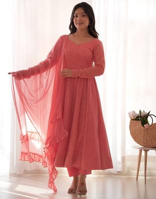 Charming pink anarkali suit with all-over embroidery, ruffled net dupatta, and matching pants   ideal for festive looks. 1