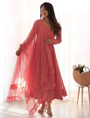 Charming pink anarkali suit with all-over embroidery, ruffled net dupatta, and matching pants   ideal for festive looks. 2