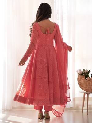 Charming pink anarkali suit with all-over embroidery, ruffled net dupatta, and matching pants   ideal for festive looks. 3
