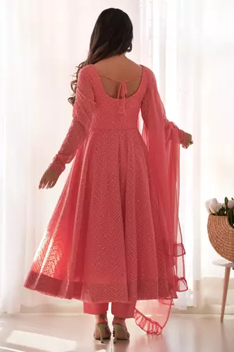 Charming pink anarkali suit with all-over embroidery, ruffled net dupatta, and matching pants   ideal for festive looks.