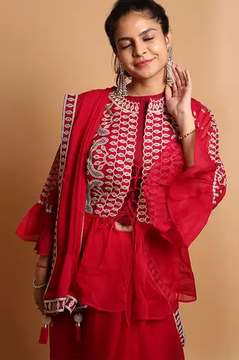 Crimson designer saree with jacket style ready blouse.