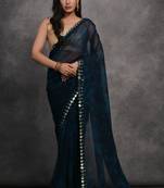 Dark blue printed georgette saree with mirror work border