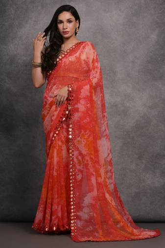 Red printed georgette saree with mirror work border