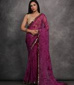 Purple printed georgette saree with mirror work border