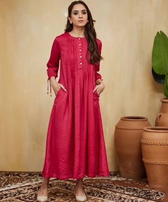 Pink plain cotton stripe kurti with tassel details. 1