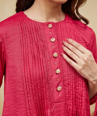 Pink plain cotton stripe kurti with tassel details. 3