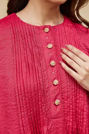 Pink plain cotton stripe kurti with tassel details.