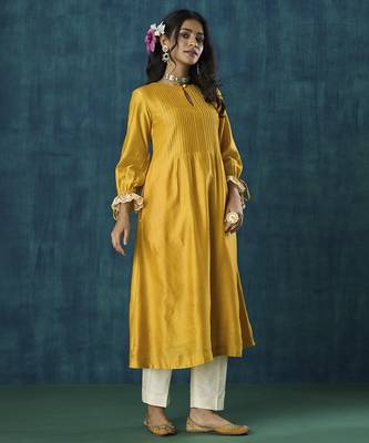 Yellow plain flowy chanderi kurti with handmade tassels 1
