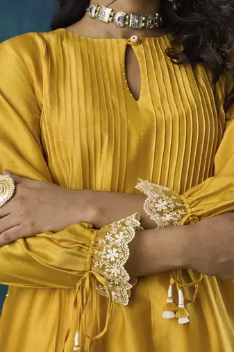 Yellow plain flowy chanderi kurti with handmade tassels