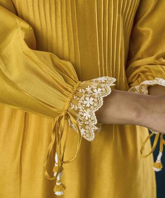 Yellow plain flowy chanderi kurti with handmade tassels 4