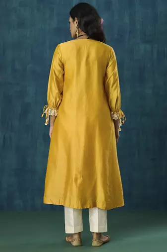 Yellow plain flowy chanderi kurti with handmade tassels