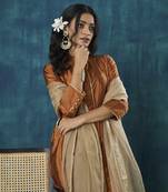Rust tissue plain kurta with pant and dupatta.