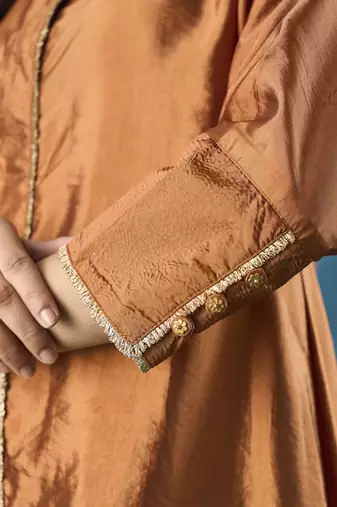 Rust tissue plain kurta with pant and dupatta.