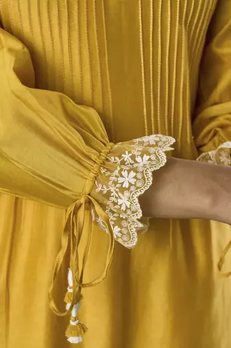 Yellow plain flowy chanderi Kurta with handmade tassels