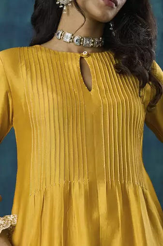 Yellow plain flowy chanderi Kurta with handmade tassels