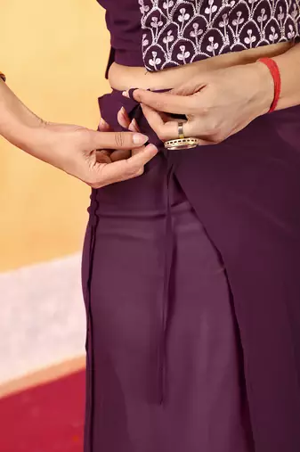 pre draped dark wine georgette saree with embroidered blouse and waist belt