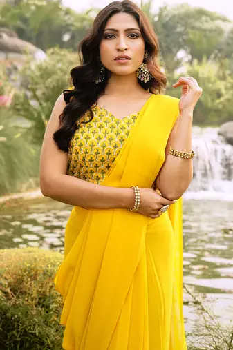 pre-stitched yellow georgette saree with embroidered blouse and waist belt