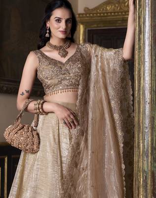 beige sequins and thread embroidered gold rush fabric indian designer latest design wedding lehenga dress 3