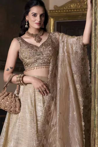 beige sequins and thread embroidered gold rush fabric indian designer latest design wedding lehenga dress
