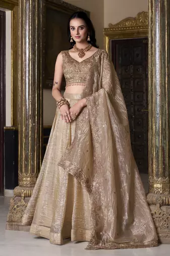 beige sequins and thread embroidered gold rush fabric indian designer latest design wedding lehenga dress