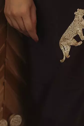 Wine plain silk blend saree with leopard design embroidery