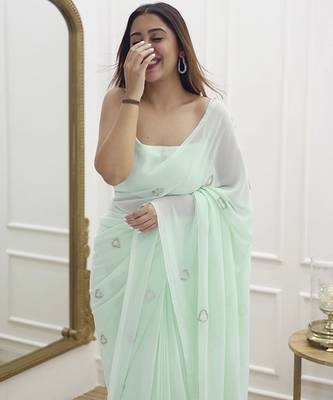 Pastel green plain georgette saree with heart motifs 2