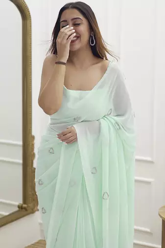 Pastel green plain georgette saree with heart motifs