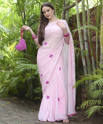 Pink plain georgette saree featuring heart motifs 1